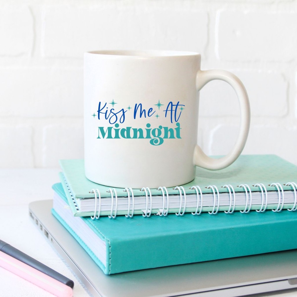 Free kiss me at midnight used on a white coffee mug.
