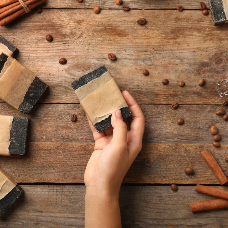 Wrapping paper around a bar of soap on a wooden background.