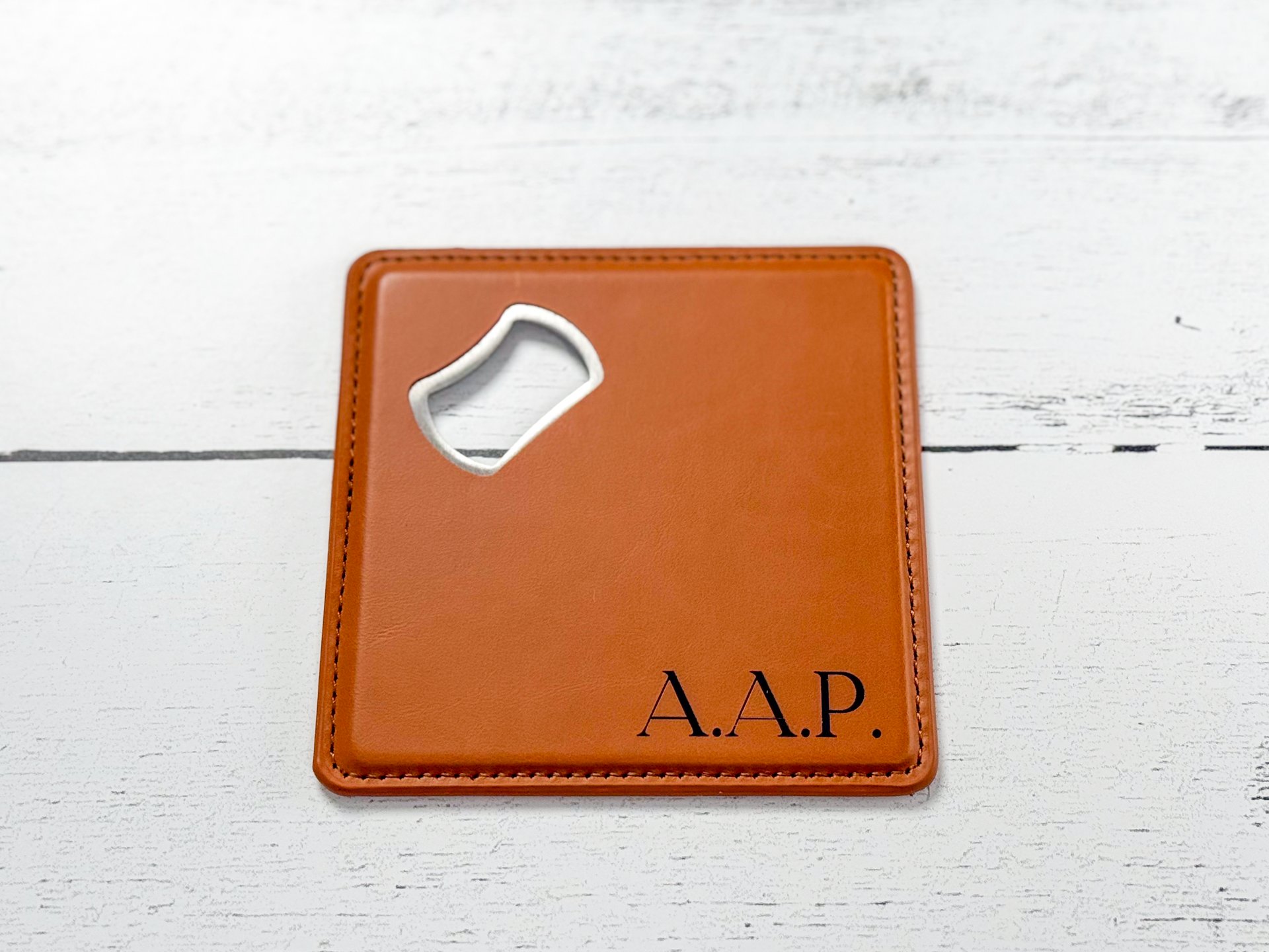 Rawhide Laserette bottle opener coaster laser engraved with A.A.P. initials
