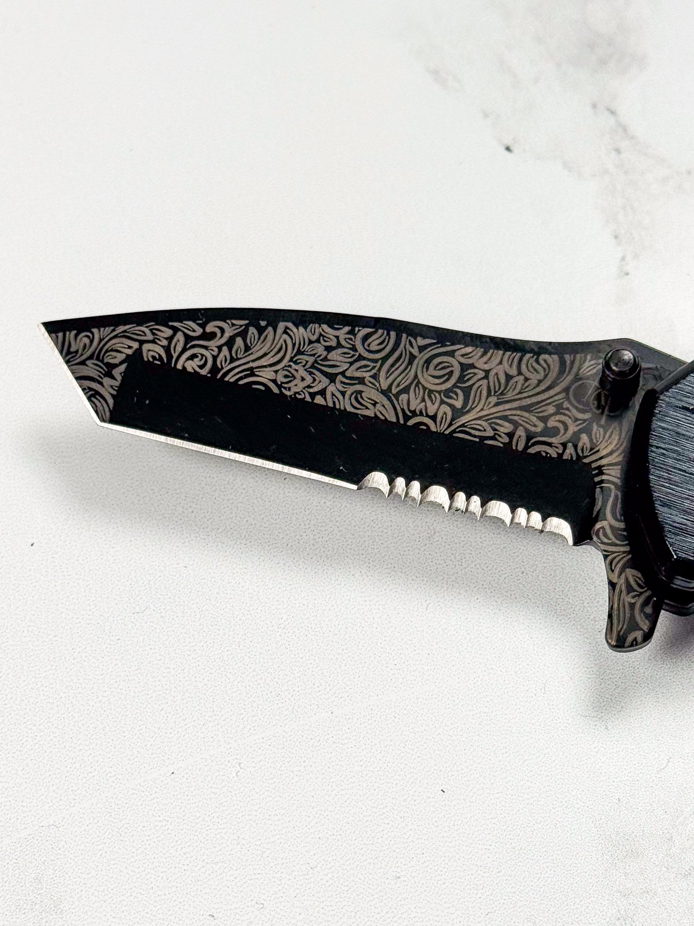 Knife blade engraved with the WeCreat Lumos Flex