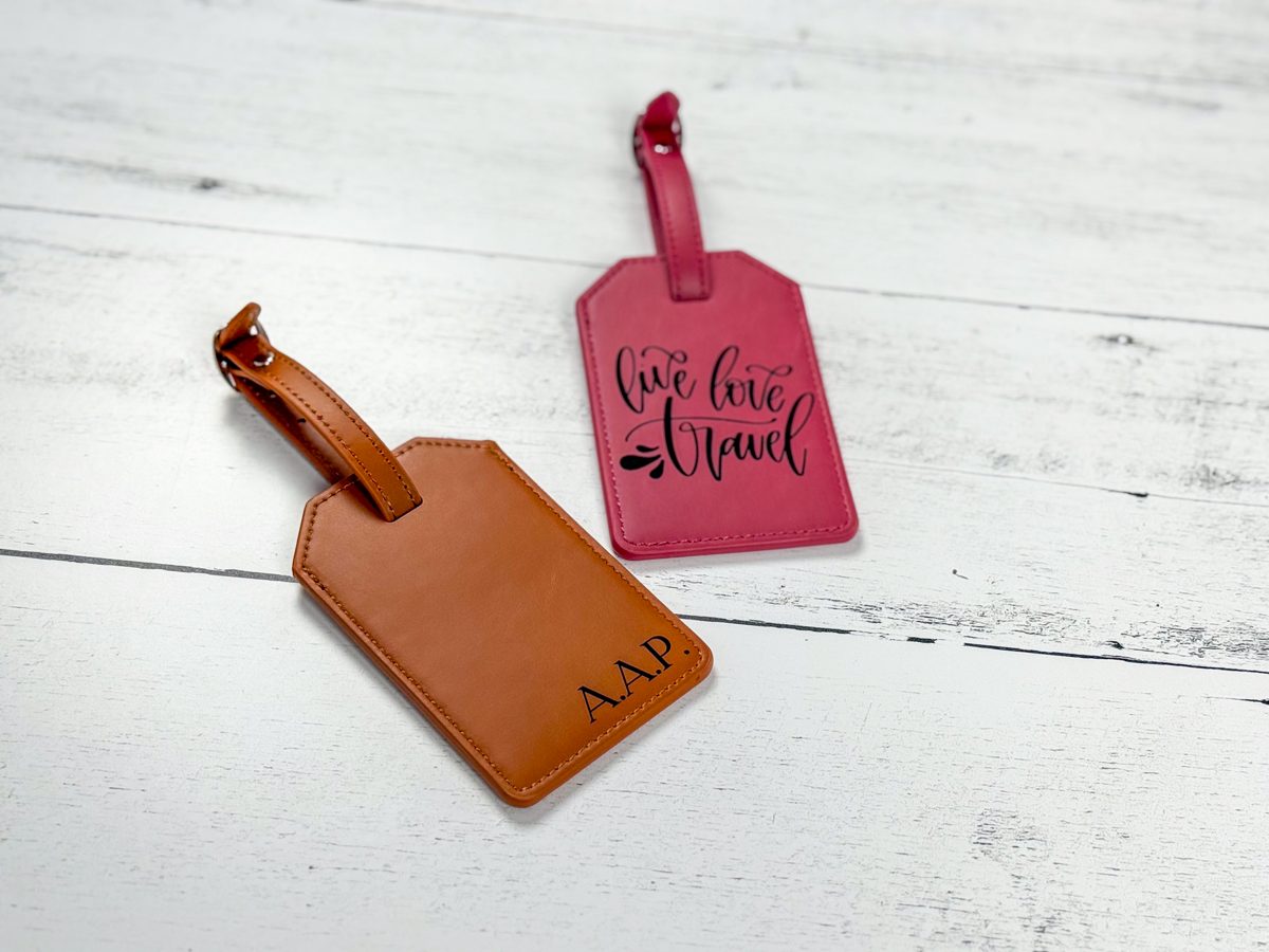 Laser engraved faux leather luggage tags in tan and pink