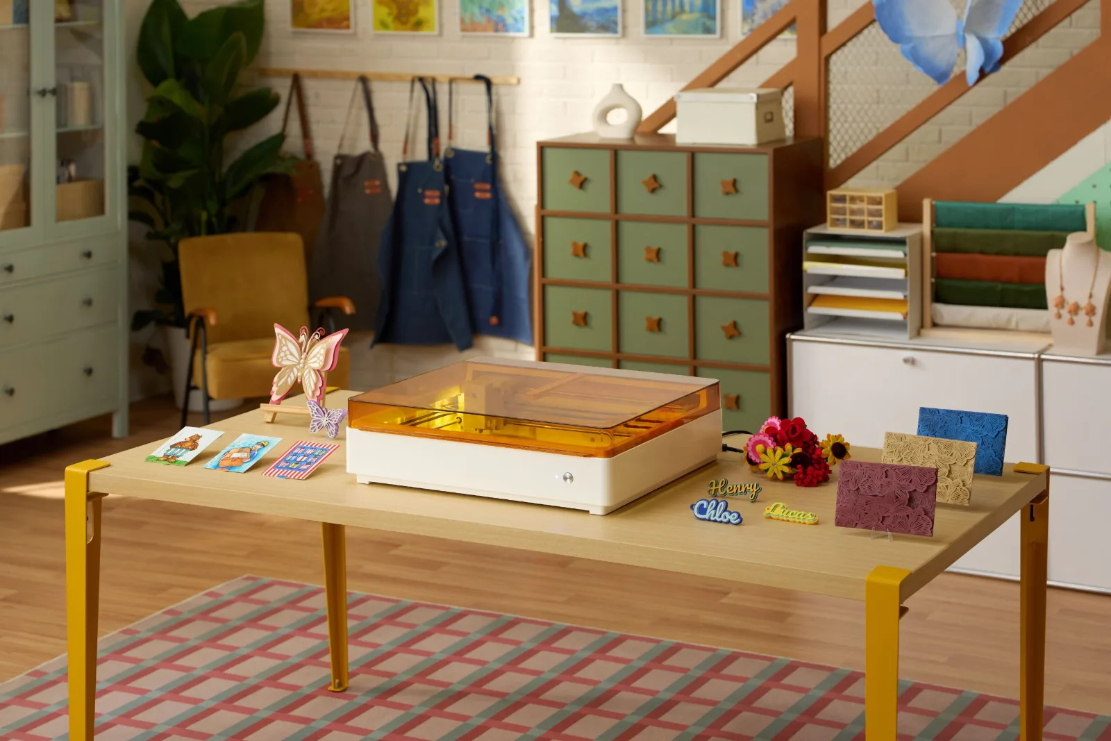 xTool M2 color craft laser in a craft room with paper and felt projects